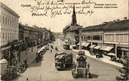 1915 Újvidék, Novi Sad; Kossuth Lajos utca, Kereszt, villamosok, piac, Klein és Popper üzlete. Urbán Ignác kiadása / street view with Cross, trams and shops (szakadás / tear)