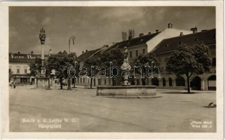 Lajtabruck, Bruck an der Leitha; Hauptplatz, Eisen Handlung, Carl Ibel, Cafe Rathhaus. Photo Mörtl / Fő tér, üzletek, Városház kávéház / main square, shops, cafe