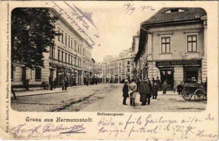 1902 Nagyszeben, Hermannstadt, Sibiu; Heltauergasse / Disznódi utca, Julius Wermescher, Carl Landmann üzlete, Transsylvania szálloda. G. A. Seraphin kiadása / street view, shops, hotel + 'NAGY-SZEBEN - KIS-KAPUS 149. SZ.' vasúti mozgóposta