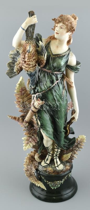 Nagyméretű vadászó Diana / Artemis. Minton (Anglia), 19. sz. vége, festett, mázas majolika, gazdag díszítéssel, talapzatán masszába nyomott gyári jelzés (M) és 8769-as formaszám, kezénél szépen restaurált, néhol apró