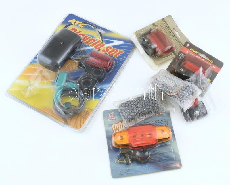 Kerékpáros kiegészítők: lámpák, fényvisszaverő prizmák, lakat, összesen 10 db, nagyrészt eredeti csomagolásban