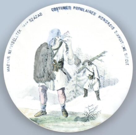 Fischer Ignác fajansz tál a ,,magyar népviseletek' sorozatból. Máz alatti matricás,. Jelzett, kevés kopással, apró csorba restaurálással. D: 20,5 cm