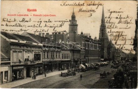 1910 Újvidék, Novi Sad; Kossuth Lajos utca, piac, Pesti Magyar kereskedelmi bank, Vegytisztító gyár, Jovicsin M., Hildegarde üzlet. Ábrahám János kiadása / street, market, shops