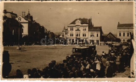 1940 Kézdivásárhely, Targu Secuiesc; bevonulás, katonai mentőautók, horogkeresztes zászló, Mánya Ernő üzlete / entry of the Hungarian troops, military ambulance vehicles, swastika flag, shop. photo + '1940 Kézdivásárhely visszatért'