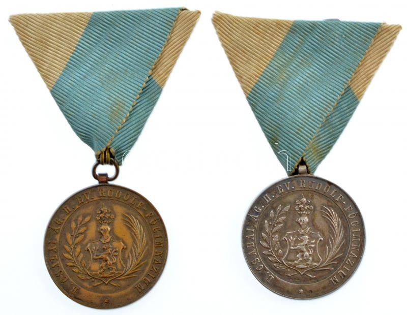 ~ 1900. 'Békéscsabai Ág. Hitv. Ev. Rudolf - Főgimnázium' jelzett Ag és bronz emlékmedál pár, az ezüstmedálon 'SGA' gyártói jelzés, mindkettő mellszalagon (14,68g/0.800/33mm) T:1-,2