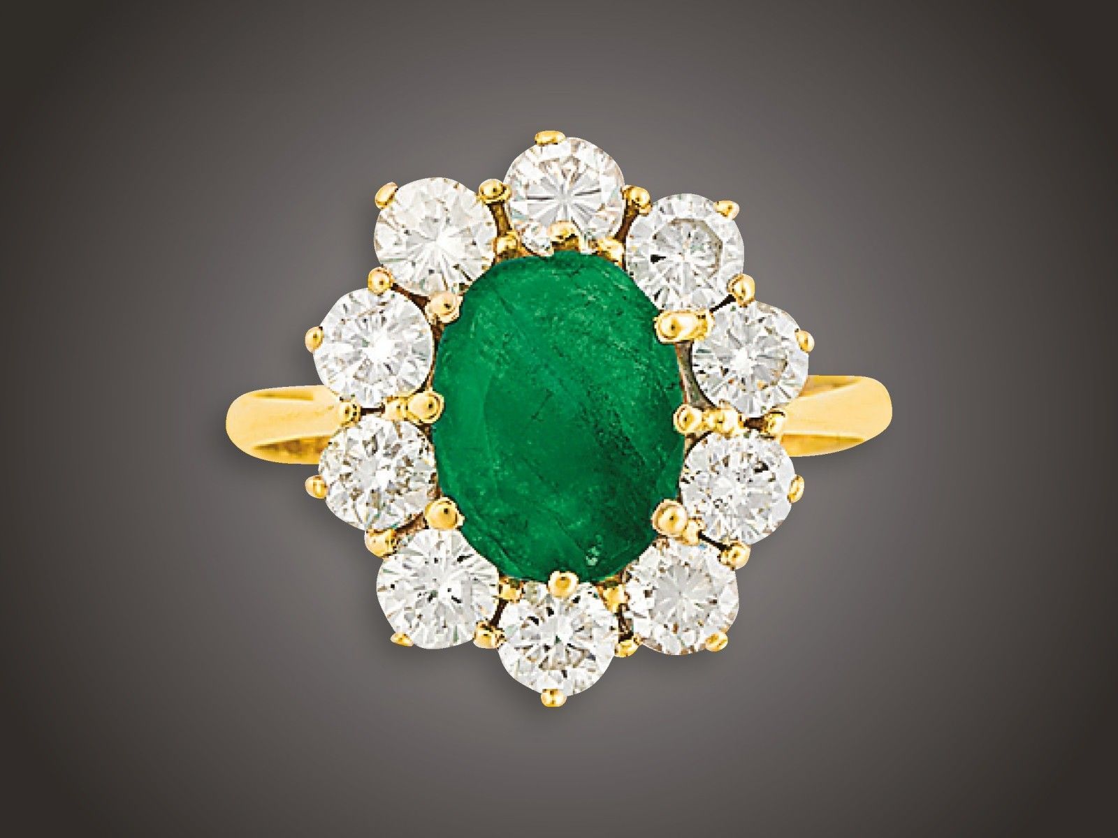 Gyűrű, 750 au, 1 smaragd cca. 1,20 ct, 10 bril. cca,. 1,20 ct, 4,2 g