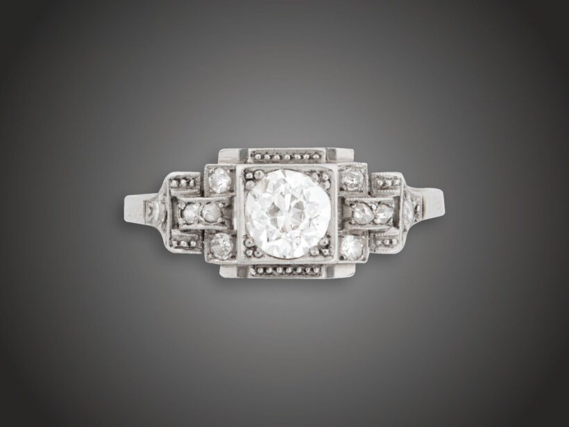 Gyűrű, 750 au, 1 bril. cca. 0,60 ct, 10 gyém. cca. 0,10 ct, 2,9 g