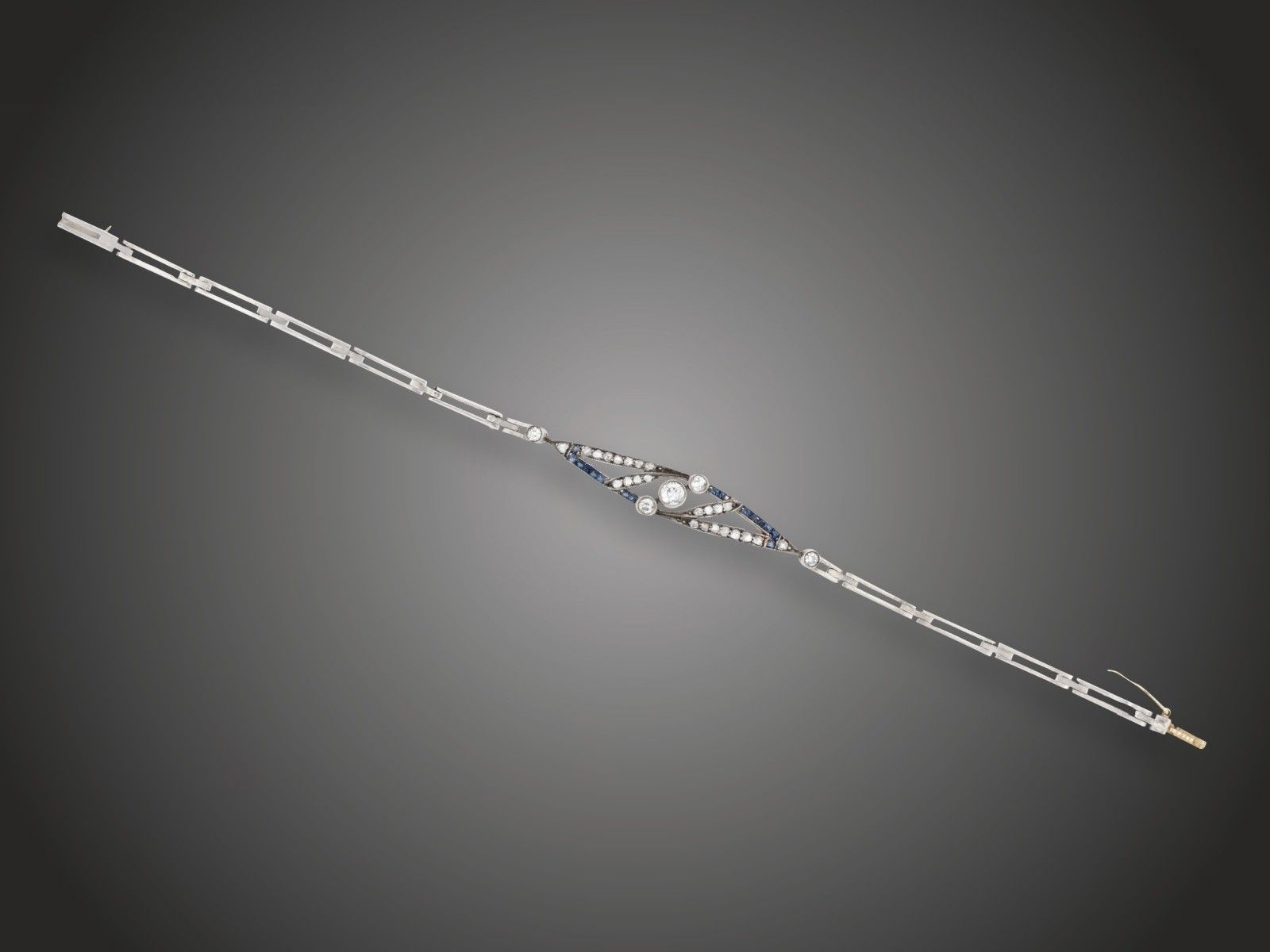 Karkötő, au, ag 925, 5 bril. cca. 0,30 ct, 24 gyém. cca. 0,20 ct, zafír, 5,8 g