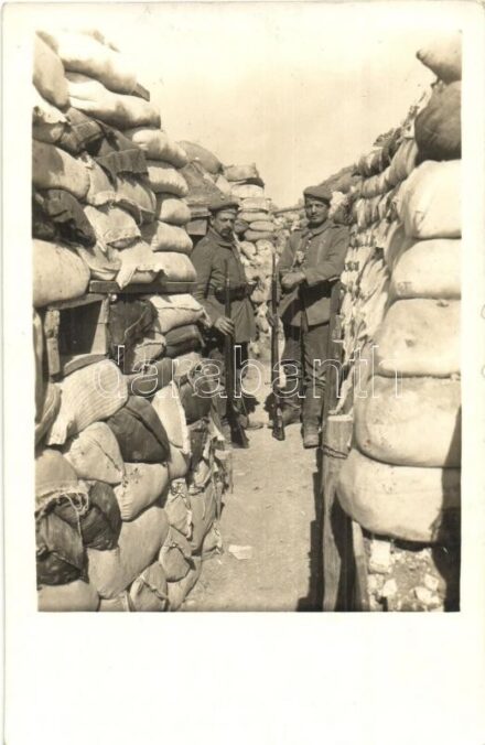 Sziklás talajon homokzsákokból kiépített lövészárok / WWI K.u.K. military, trenches built from sandbags. photo