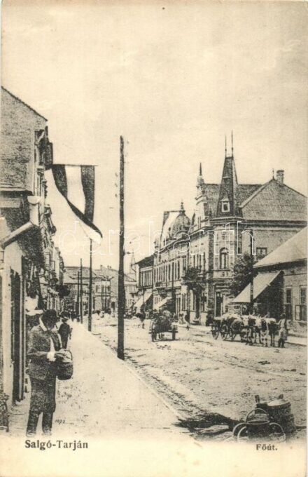 1911 Salgótarján, Fő út, magyar zászló, lovas és ökrös szekerek, üzletek. Kiadja Friedler Ármin (EK)
