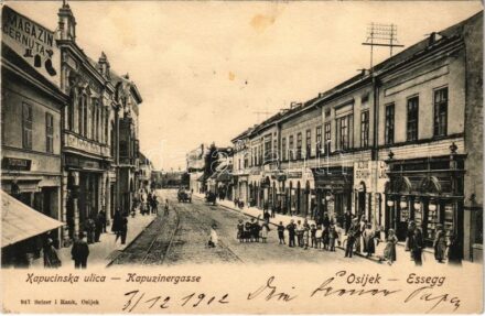 1902 Eszék, Essegg, Osijek; Kapucinska ulica / Kapuzinergasse / Kapucinus utca, Th. Gottschalk, J. Bozic, Victor Fritsche üzlete, Takarékpénztár, Knittel fényképészeti műterme / street view, shops, savings bank, photography atelier (fl)
