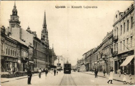 Újvidék, Novi Sad; Kossuth Lajos utca, villamos, Aich Nándor üzlete / street, tram, shops