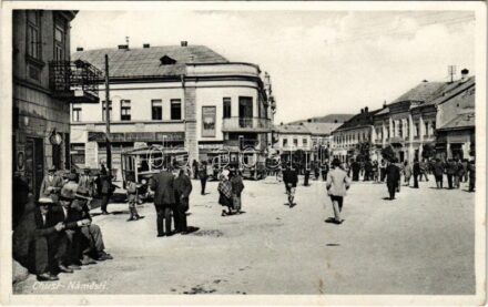 1939 Huszt, Chust, Khust; Námestí / utca, Hitelbank, autóbuszok, üzletek. Petr Koverdynsky kiadása / street view, loan bank, autobus, shops + kétnyelvű bélyegző / bilingual cancellation
