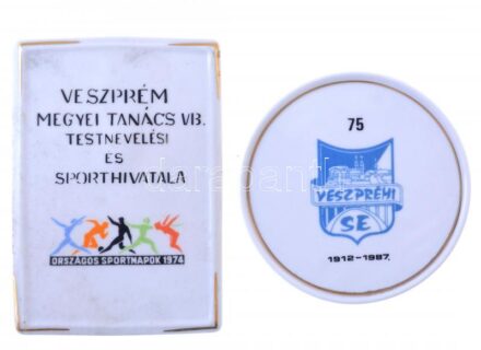 1974. 'Veszprém Megyei Tanács VB. Testnevelési és Sporthivatala' festett, jelzett hollóházi porcelán plakett (113x80mm) + 1987. 'Veszprém SE 1912-1987' festett, jelzett hollóházi porcelán plakett tokban (89mm)
