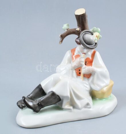 Ménesi Katalin: Furulyázó paraszt. Zsolnay vizsgadarab. Kézzel festett porcelán, jelzett, Zsolnay jelzés nincs benne, hibátlan, m: 20 cm