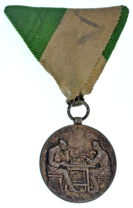 Berán Lajos (1882-1943) 1929. "Hangya Sakkverseny 1929 II. díj - Löffler Jenő" jelzetlen Ag díjérem mellszalagon, "SGA" gyártói jelzéssel (~13g/29mm) T:XF patina / Hungary 1929. "Hangya Sakkverseny 1929 II. díj - Löffler Jenő" unmarked Ag award medal with ribbon, with "SGA" maker's mark. Sign.: Berán (~13g/29mm) C:XF