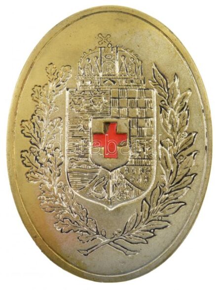 ~1914-1918. Magyar királyi címeres fém jelvény festett vöröskereszttel, 'Morzsányi, Budapest, J. Eskü-ut. 5.' gyártói jelzéssel (45x62mm) T:2 festésben kis lepattogzás