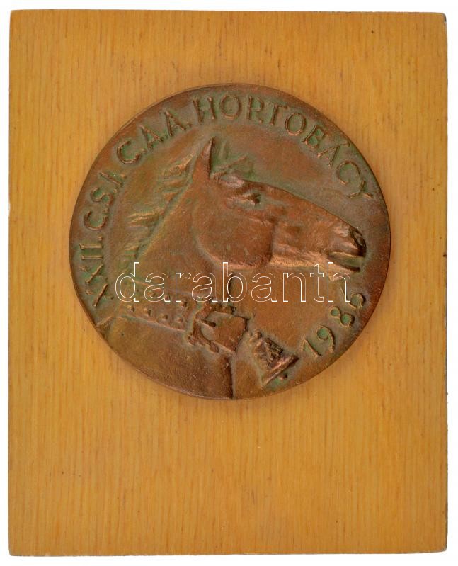 Somogyi Árpád (1926-2008) 1986. 'XXII. C.S.I.C.A.A. Hortobágy' egyoldalas bronz emlékérem fa talapzatra applikálva (érem:74mm, keret:152x101mm) T:2 patina