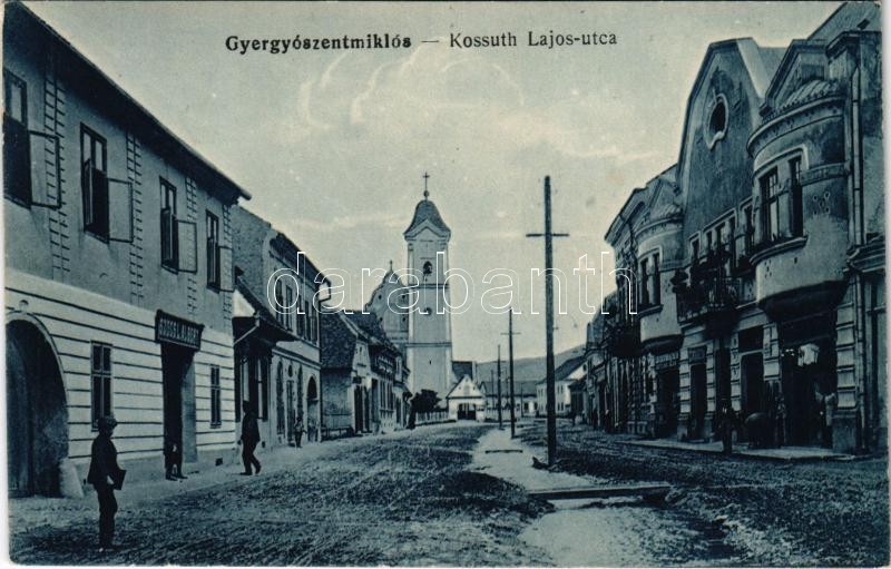Gyergyószentmiklós, Gheorgheni; Kossuth Lajos utca, Szőcs L. Albert üzlete / street view, shops
