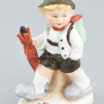 Esernyős fiú jelzett német porcelán figura. Kis kopással 10 cm