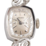 Arany (Au) fehérarany tokos Longines karóra, mechanikus szerkezettel, működik, brillekkel ékítve, jelzett, d: 18mm, bruttó: 9,8g