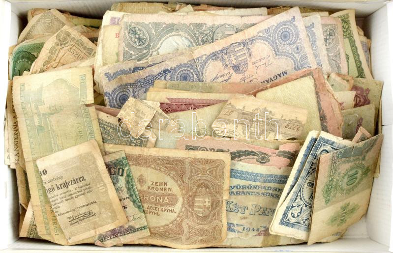 Egy doboznyi vegyes, nagyrészt kifejezetten rossz tartású (szakadt, foltos, hiányos) magyar és külföldi bankjegy tétel T:IV,V Box of Hungarian and foreign banknotes, mainly in bad condition (tear, spots, missing material) C:G,Pr