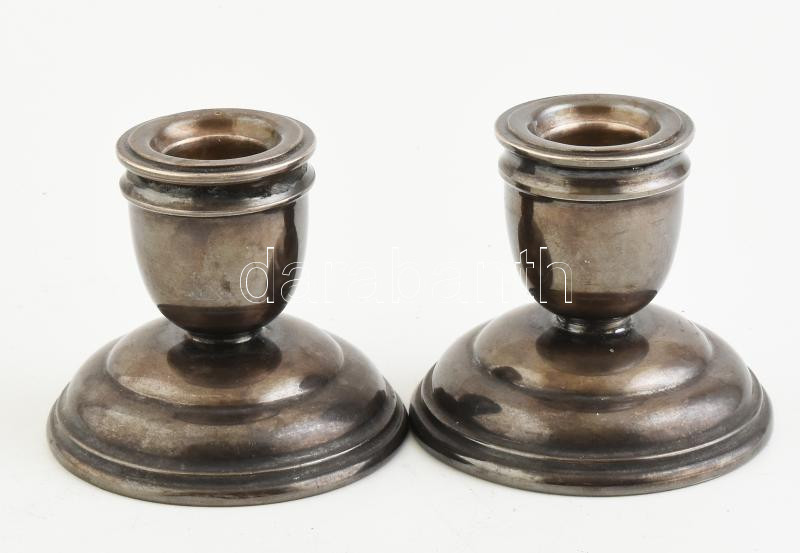 Ezüst (Ag) 1 pár szombati gyertyatartó. Jelzett, töltött alj. m: 6 cm. bruttó: 209 g.