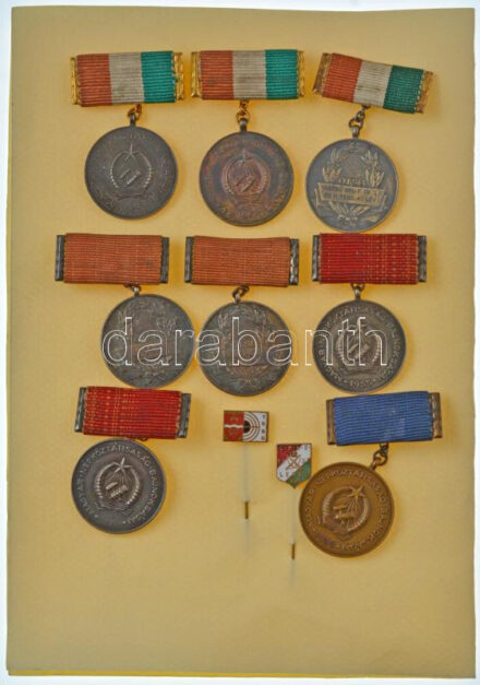 1953-1956. 'Magyar Népköztársaság Bajnokságai / OTSB' (8xklf) bronz lövész díjjelvények, hátoldalukon mindegyik gravírozva, I-III. helyezések érmei (50x35mm/db) + 1937. 'Lehel Polgári Lövész Egyesület' zománcozott bronz jelvény