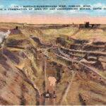 1939 Hibbing (Minnesota), Buffalo-Susquehanna Mine. Showing a combination of open pit and underground mining, depth 450 feet, industrial railway, train