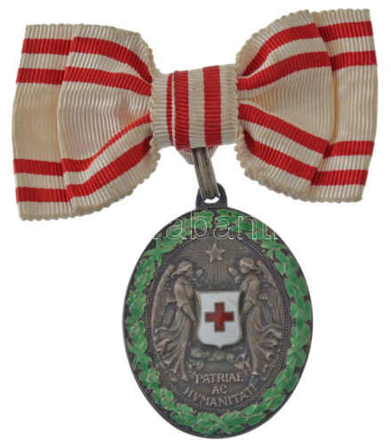 1915. 'Vörös Kereszt Ezüst Díszérme hadidíszítménnyel' női csokorszalagon, Ag kitüntetés, fémjel a fülön T:AU / Hungary 1915. 'Red-Cross Silver Medal with Military Ornament' on women's ribbon, Ag decoration, hallmark on ear C:AU NMK