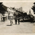 1938 Munkács, Mukacheve, Mukachevo, Mukacevo; utca, Zipszer Adolf üzlete, büfé, kerékpár, templom / street view, shops, buffet, bicycle, church + '1938 Munkács visszatért' So. Stpl. (fl)