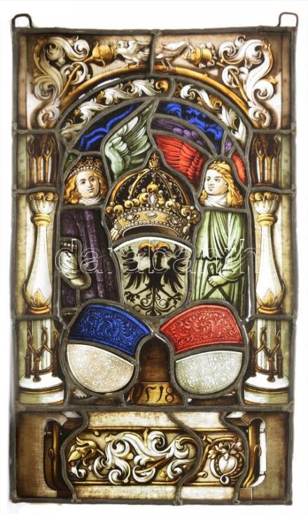 I. Ferdinánd császár és Jagelló Anna császárnő esküvőjének emlékére festett ólomüveg ablak, dísz. Osztrák császári címert tartó angyalokkal. 1518-as évszámmal. Sérült 26x44 cm / Marriage of Emperor Ferdinand and Anna Jagello. Lead glass ornament with Habs